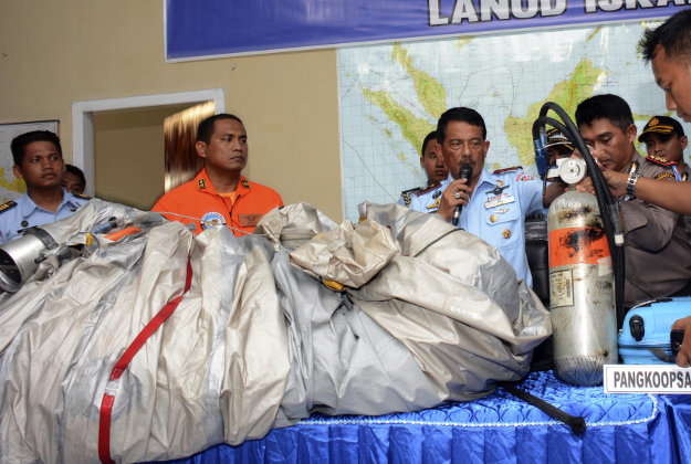 Indonesian officials show debris from AirAsia flight