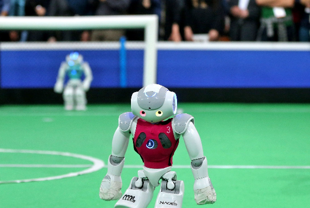 Robots play in the 2015 Iran Open RoboCup.