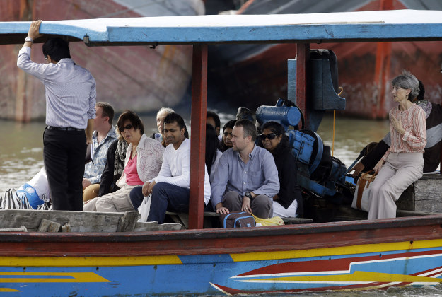 Family members of Australian death row prisoners Andrew Chan and Myuran Sukumaran and Australian Consul General in the Indonesian island of Bali Majell Hind, right, head to Nusakambangan Island by a ship at Wijaya Pura port in Cilacap, Central Java, Indonesia.