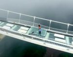 Watch as a journalist smashes China’s new glass bridge with a sledgehammer to see if it’s ready